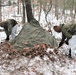 Cold-Weather Operations Course students build improvised shelters, survive outdoors