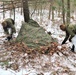 Cold-Weather Operations Course students build improvised shelters, survive outdoors