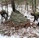 Cold-Weather Operations Course students build improvised shelters, survive outdoors