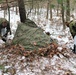 Cold-Weather Operations Course students build improvised shelters, survive outdoors