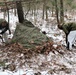 Cold-Weather Operations Course students build improvised shelters, survive outdoors