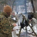 Cold-Weather Operations Course students build improvised shelters, survive outdoors