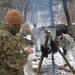 Cold-Weather Operations Course students build improvised shelters, survive outdoors