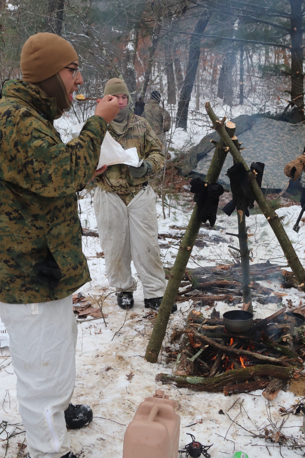 Cold-Weather Operations Course students build improvised shelters, survive outdoors