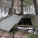 Cold-Weather Operations Course students build improvised shelters, survive outdoors