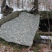 Cold-Weather Operations Course students build improvised shelters, survive outdoors