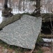 Cold-Weather Operations Course students build improvised shelters, survive outdoors