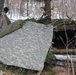 Cold-Weather Operations Course students build improvised shelters, survive outdoors