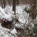 Cold-Weather Operations Course students build improvised shelters, survive outdoors