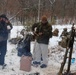 Cold-Weather Operations Course students build improvised shelters, survive outdoors