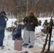 Cold-Weather Operations Course students build improvised shelters, survive outdoors