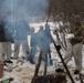 Cold-Weather Operations Course students build improvised shelters, survive outdoors