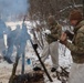 Cold-Weather Operations Course students build improvised shelters, survive outdoors