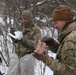 Cold-Weather Operations Course students build improvised shelters, survive outdoors