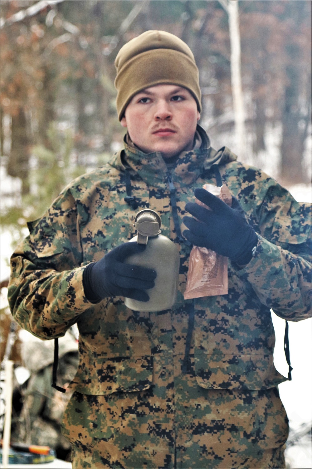 Cold-Weather Operations Course students build improvised shelters, survive outdoors