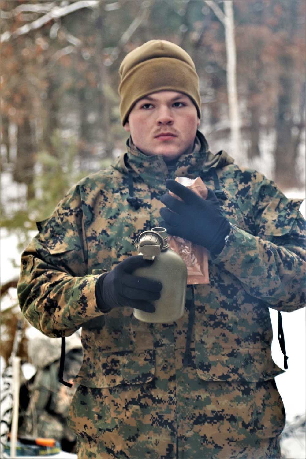 Cold-Weather Operations Course students build improvised shelters, survive outdoors