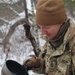 Cold-Weather Operations Course students build improvised shelters, survive outdoors