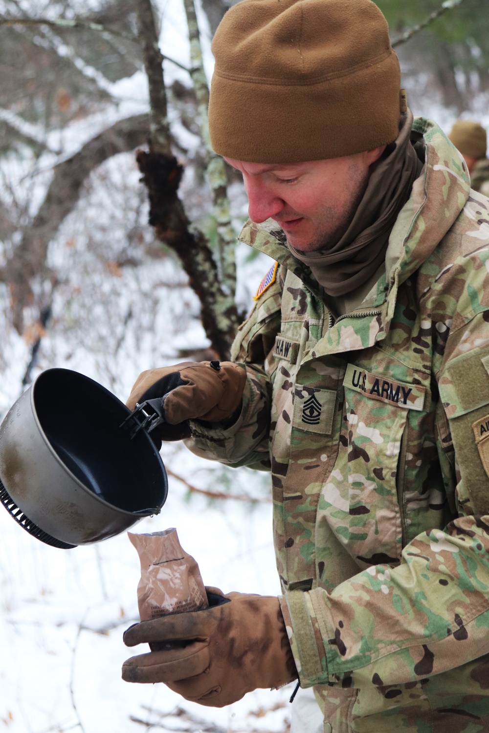 Cold-Weather Operations Course students build improvised shelters, survive outdoors