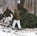 Cold-Weather Operations Course students build improvised shelters, survive outdoors