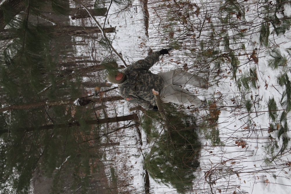 Cold-Weather Operations Course students build improvised shelters, survive outdoors