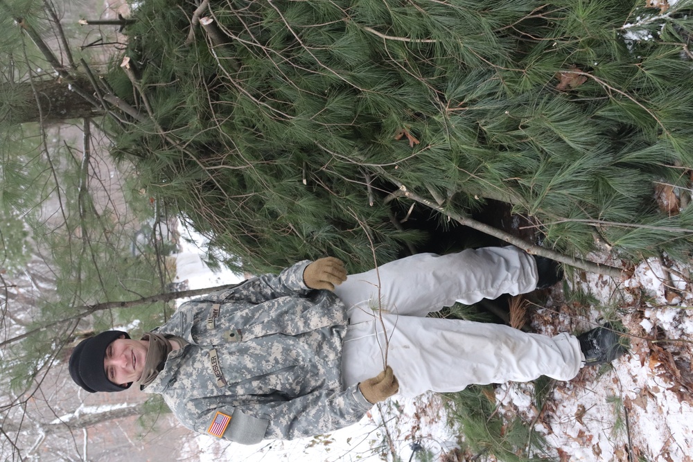 Cold-Weather Operations Course students build improvised shelters, survive outdoors