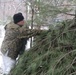 Cold-Weather Operations Course students build improvised shelters, survive outdoors