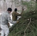 Cold-Weather Operations Course students build improvised shelters, survive outdoors