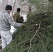 Cold-Weather Operations Course students build improvised shelters, survive outdoors