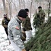 Cold-Weather Operations Course students build improvised shelters, survive outdoors