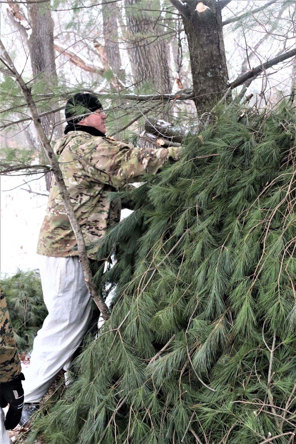 Improvised shelter building by Cold-Weather Operations Course students in Class 20-01