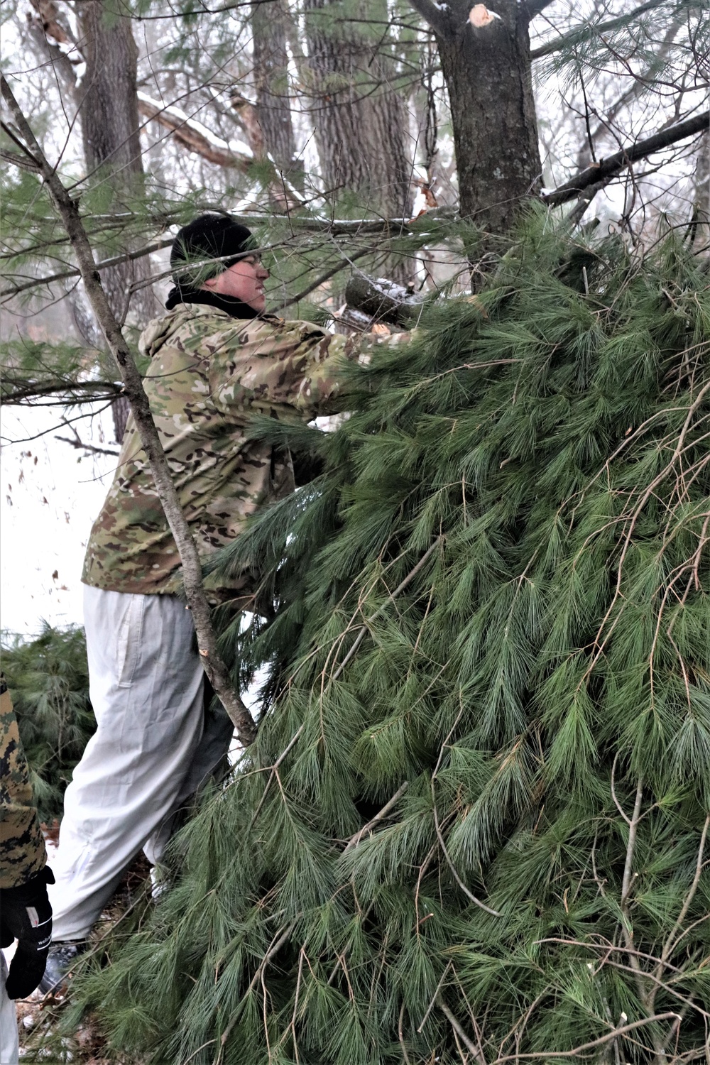 Improvised shelter building by Cold-Weather Operations Course students in Class 20-01