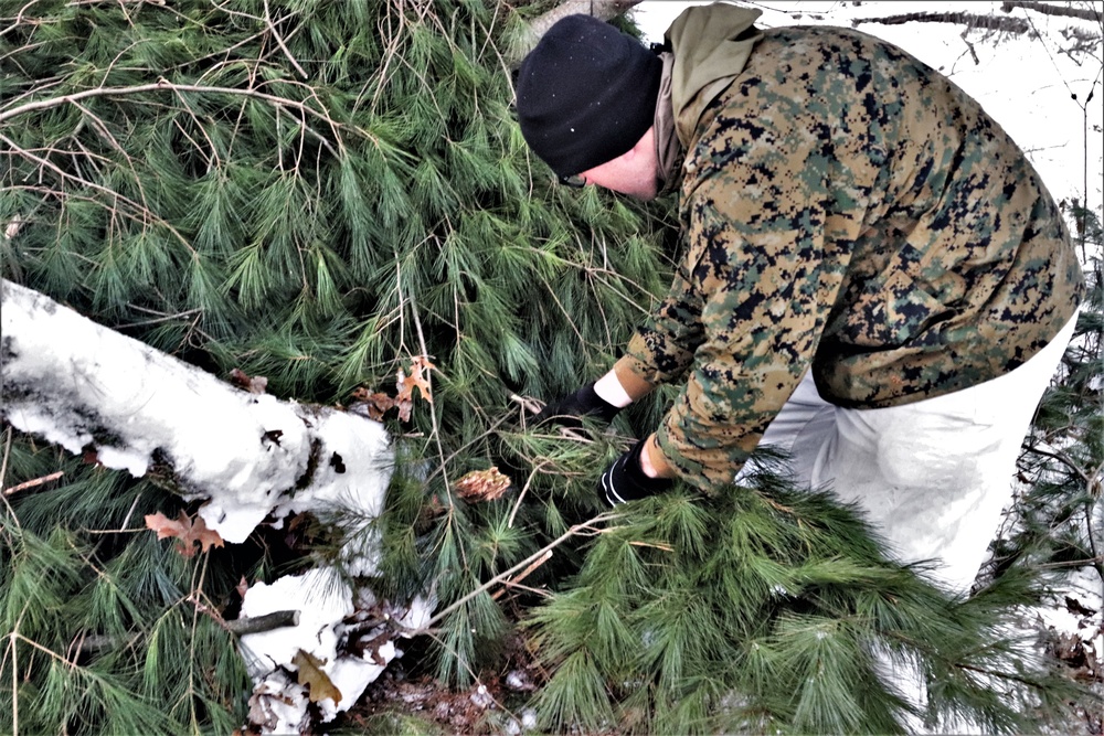 Improvised shelter building by Cold-Weather Operations Course students in Class 20-01