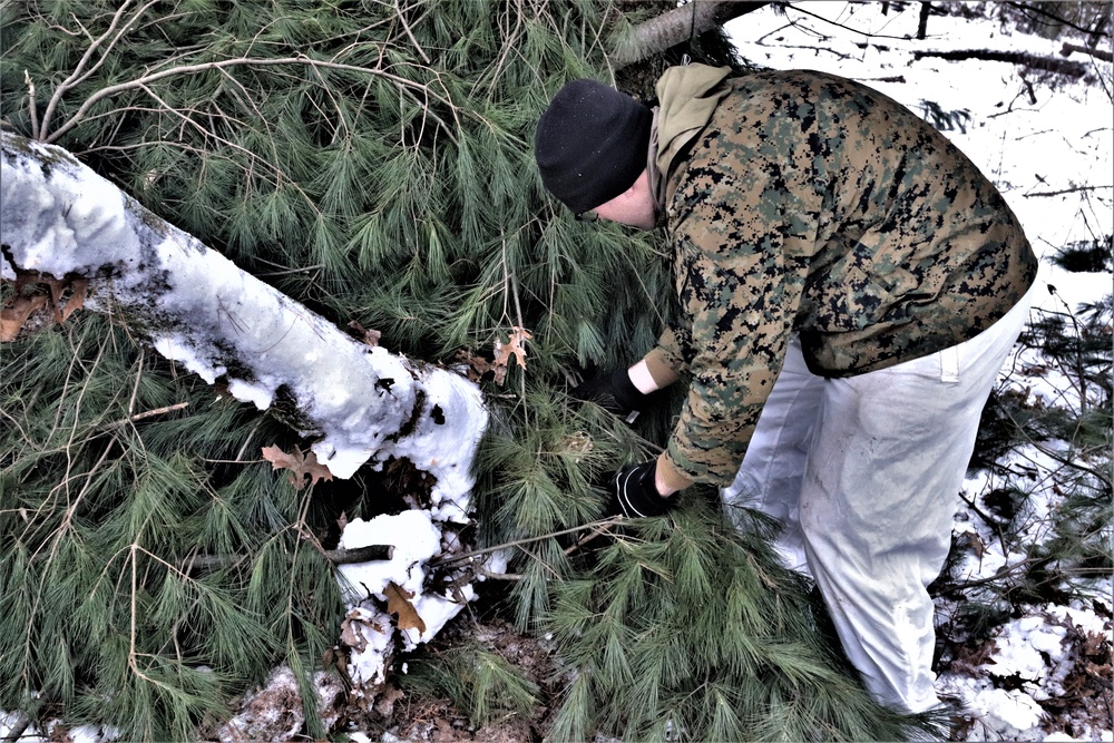Improvised shelter building by Cold-Weather Operations Course students in Class 20-01