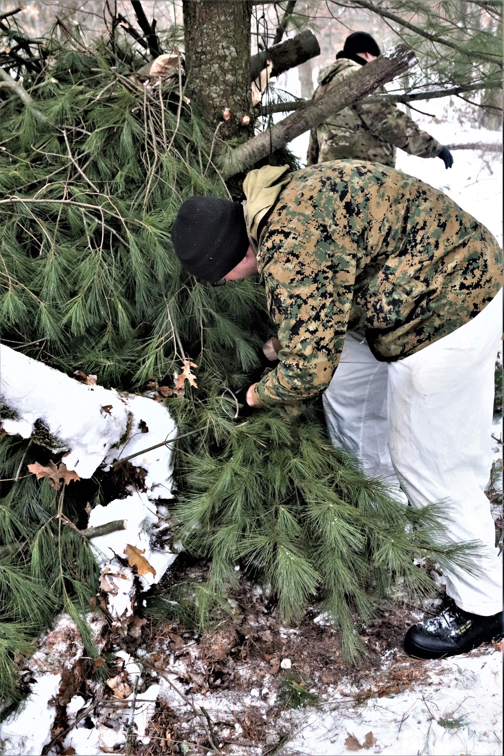 Improvised shelter building by Cold-Weather Operations Course students in Class 20-01