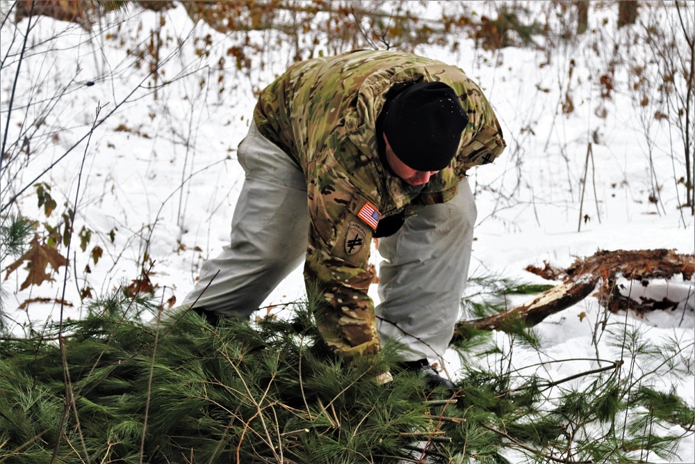 Improvised shelter building by Cold-Weather Operations Course students in Class 20-01