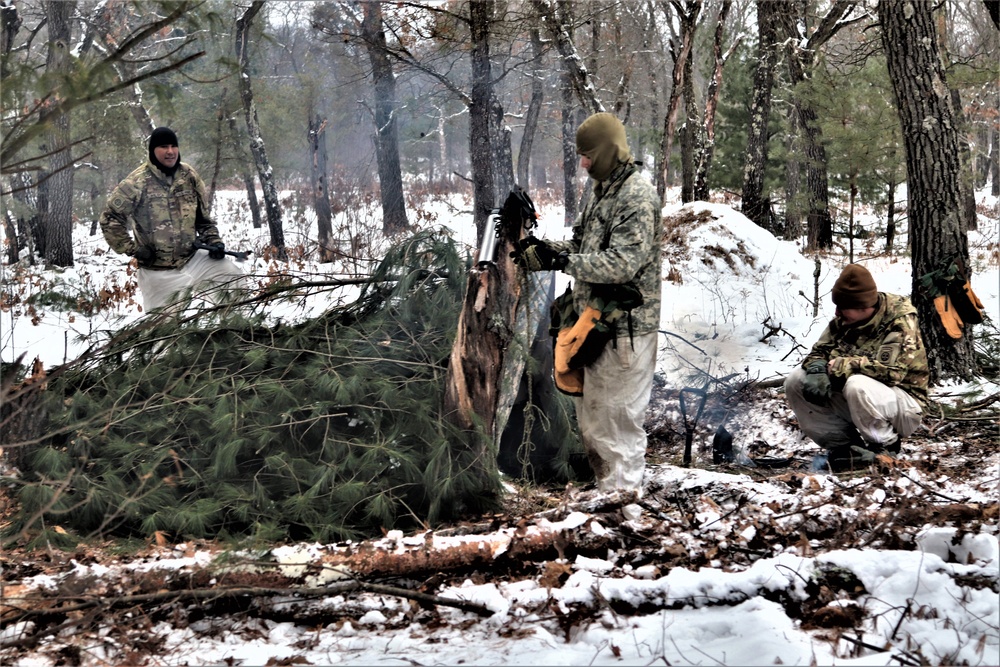 Improvised shelter building by Cold-Weather Operations Course students in Class 20-01