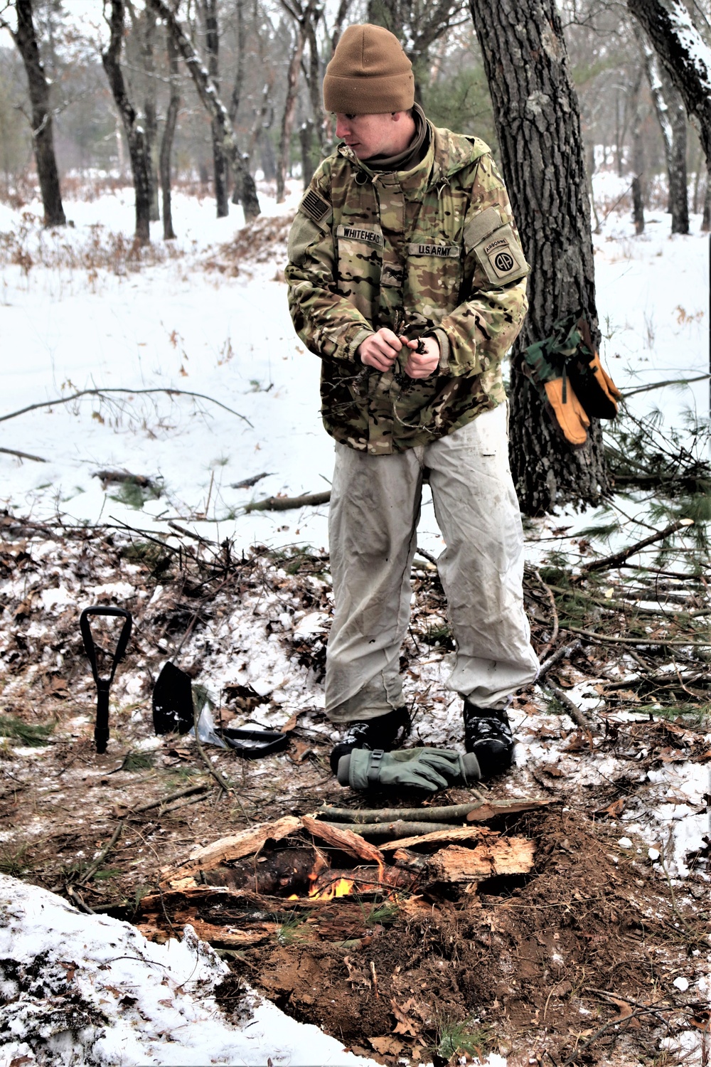 Improvised shelter building by Cold-Weather Operations Course students in Class 20-01