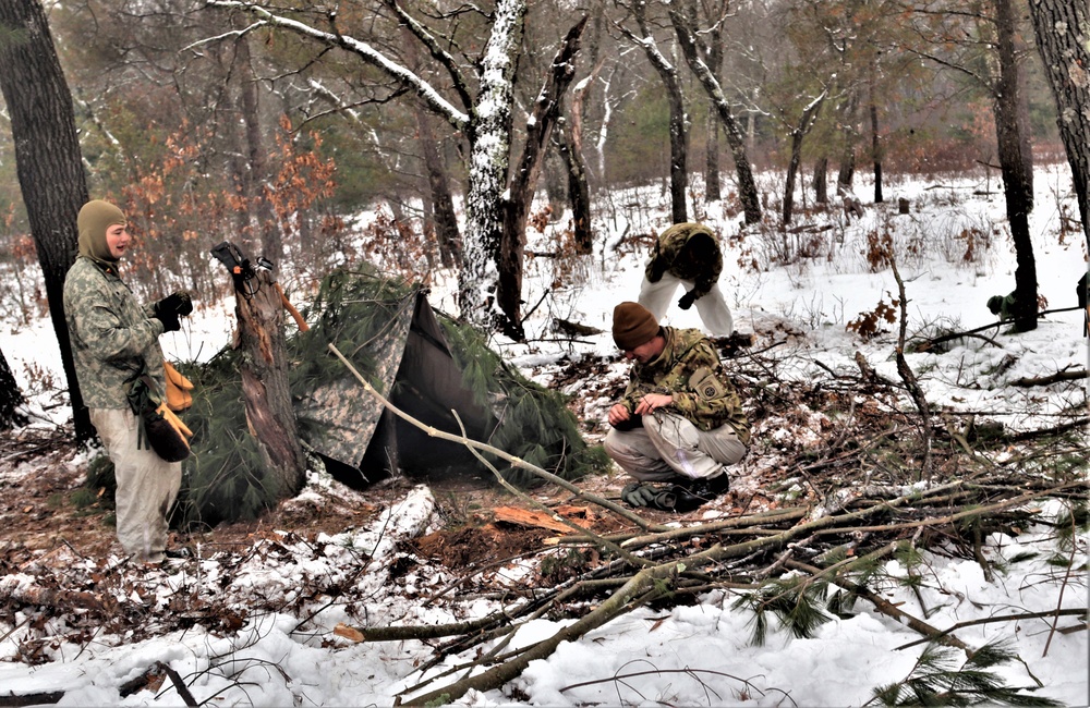 Improvised shelter building by Cold-Weather Operations Course students in Class 20-01