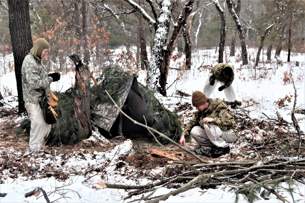 Improvised shelter building by Cold-Weather Operations Course students in Class 20-01