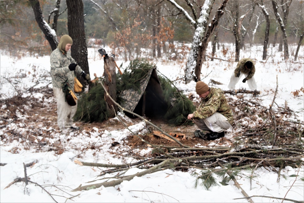 Improvised shelter building by Cold-Weather Operations Course students in Class 20-01