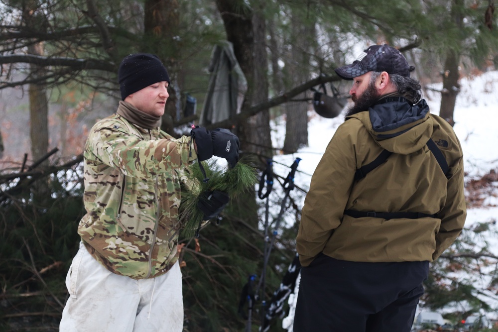 Improvised shelter building by Cold-Weather Operations Course students in Class 20-01