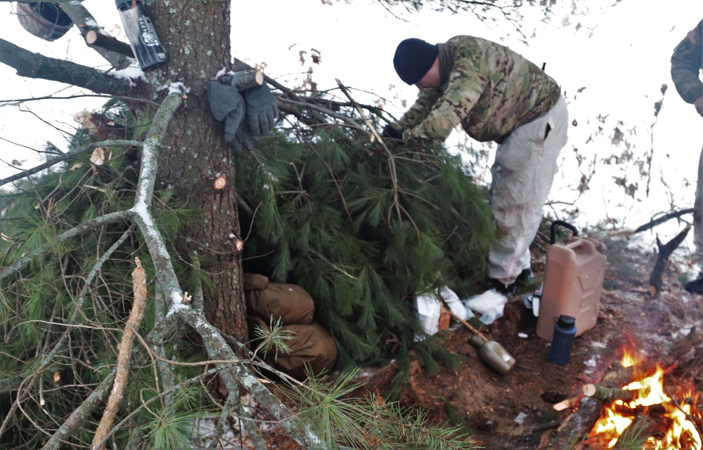 Improvised shelter building by Cold-Weather Operations Course students in Class 20-01