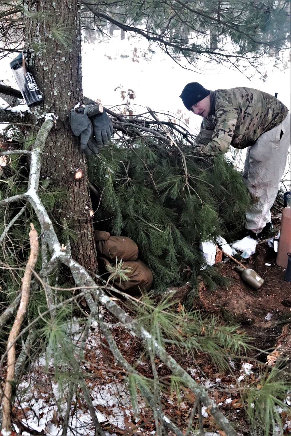 Improvised shelter building by Cold-Weather Operations Course students in Class 20-01