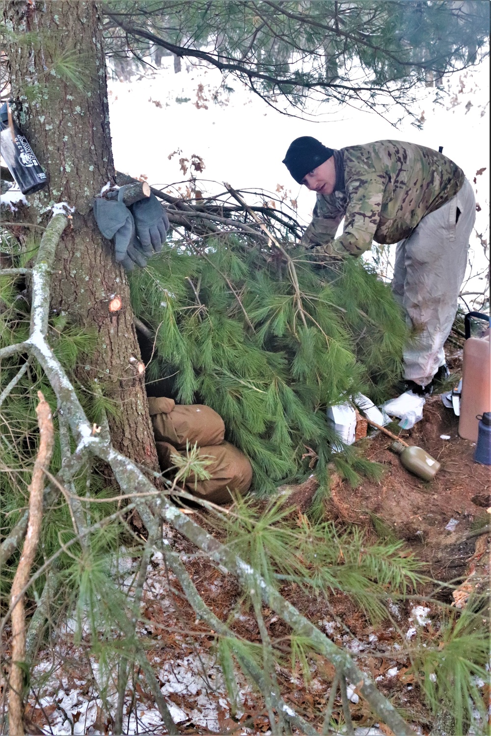 Improvised shelter building by Cold-Weather Operations Course students in Class 20-01