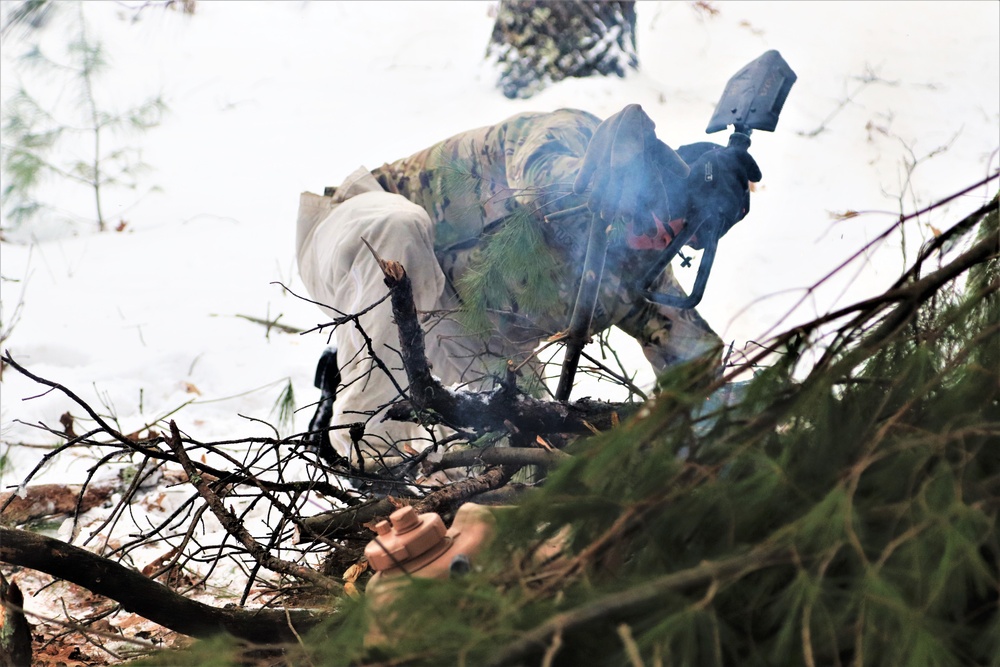 Improvised shelter building by Cold-Weather Operations Course students in Class 20-01