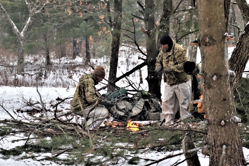 Improvised shelter building by Cold-Weather Operations Course students in Class 20-01