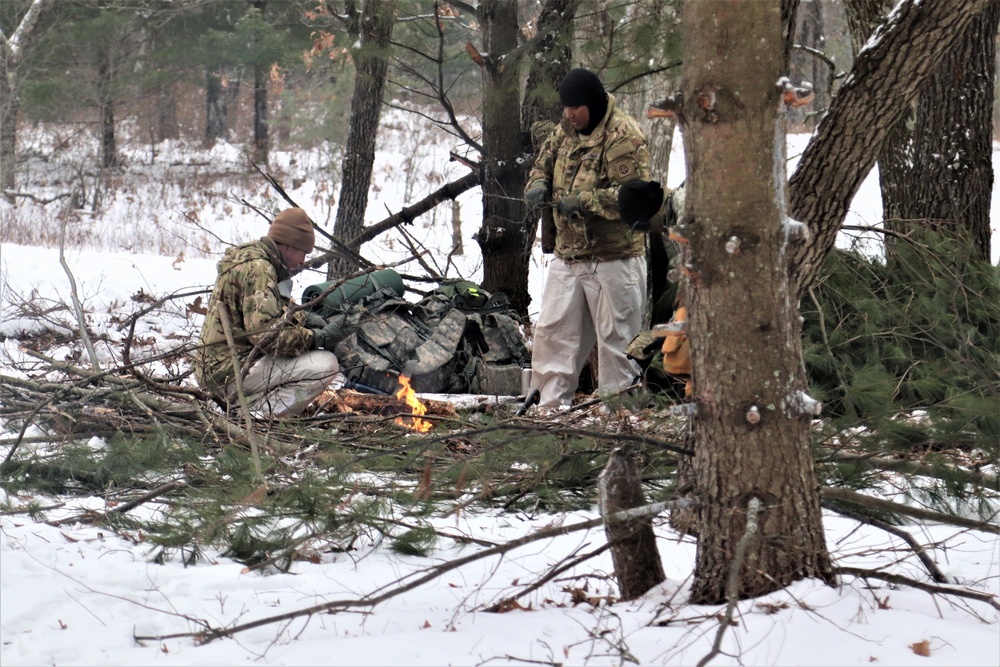 Improvised shelter building by Cold-Weather Operations Course students in Class 20-01