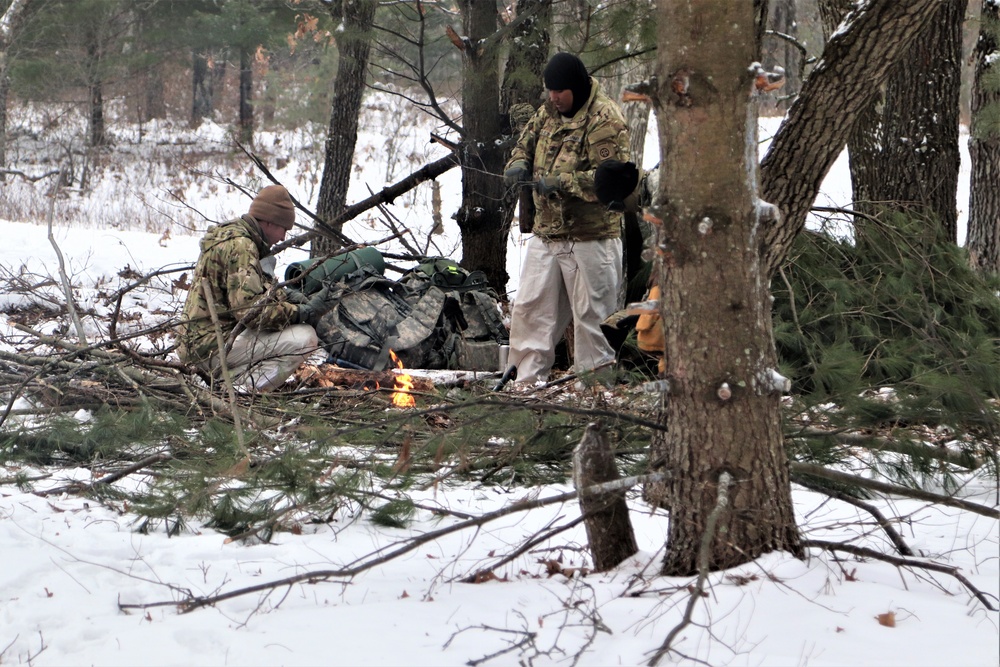 Improvised shelter building by Cold-Weather Operations Course students in Class 20-01
