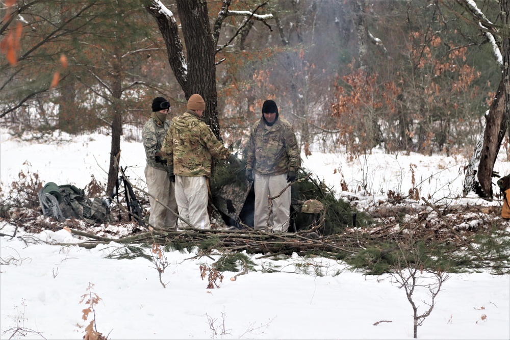 Improvised shelter building by Cold-Weather Operations Course students in Class 20-01