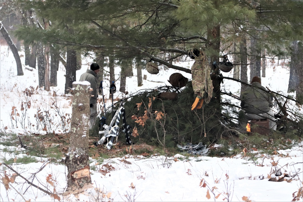 Improvised shelter building by Cold-Weather Operations Course students in Class 20-01